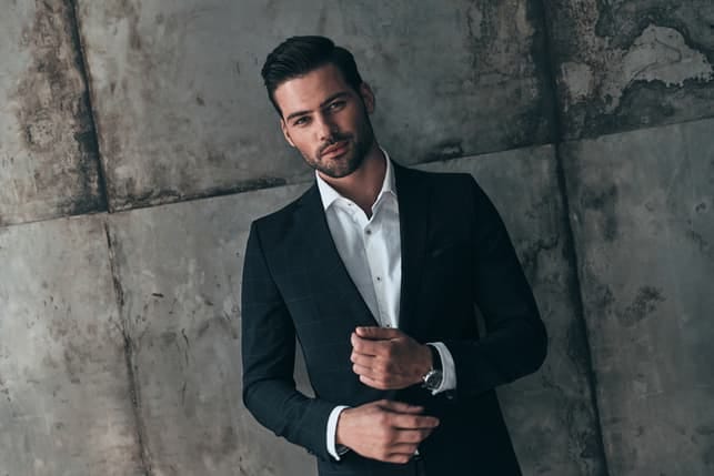 a portrait of a young man in a suit