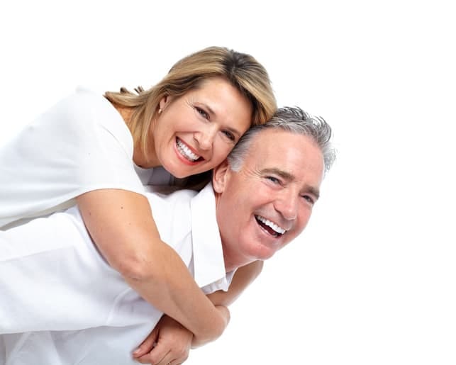 a mature couple over 50 having fun and posing together