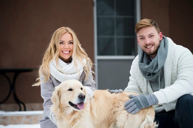 a young couple with a dog