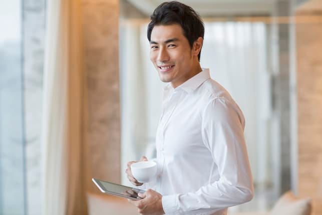 a portrait of a handsome asian man in a white shirt