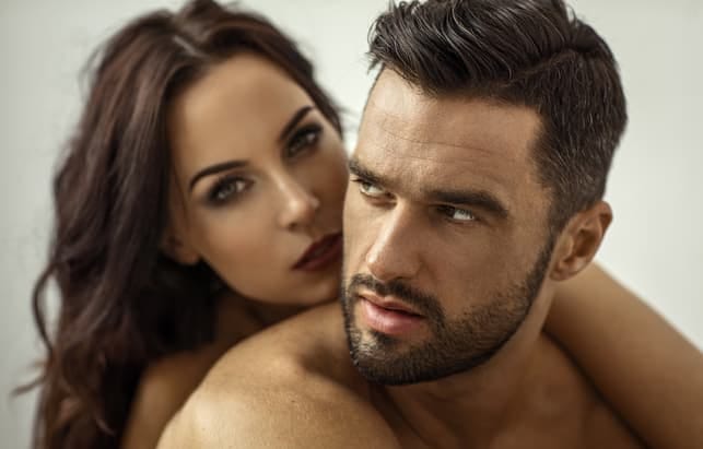 a beautiful Hispanic couple posing together
