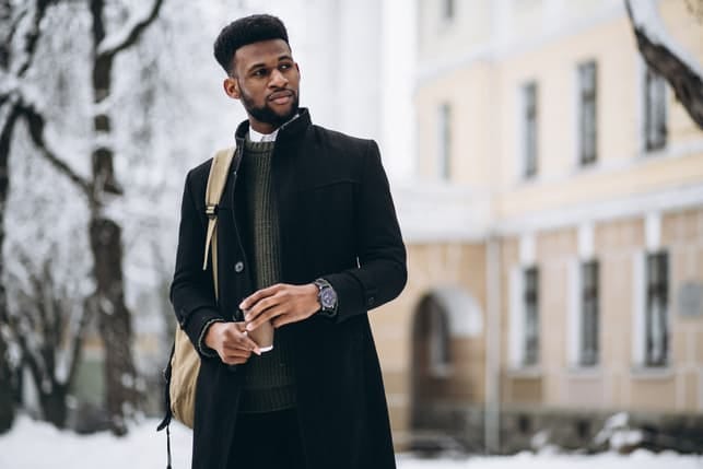 a portrait of a well-dressed black man