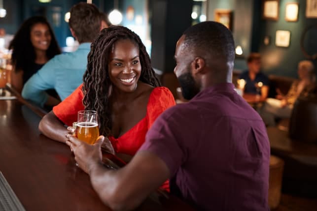 a black couple on a date in a restaurant