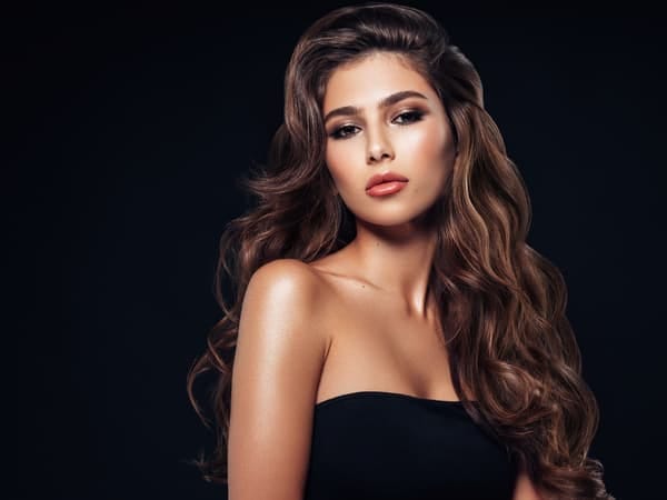 a portrait of a beautiful woman with wavy hair