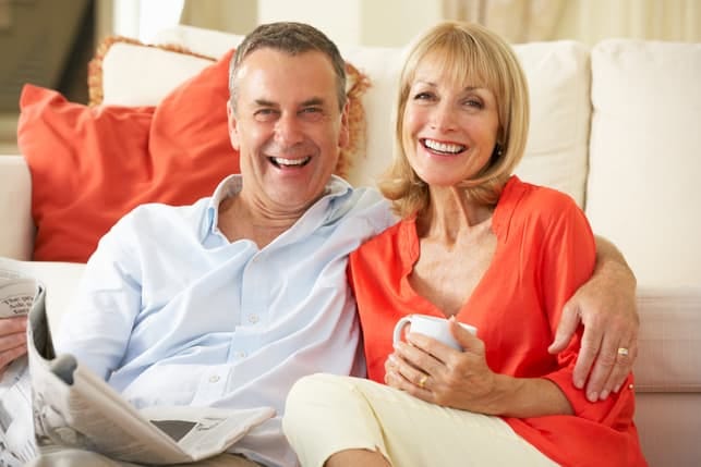 a nice young at heart couple posing at home together