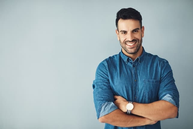 a portrait of a man wearing a blue shirt