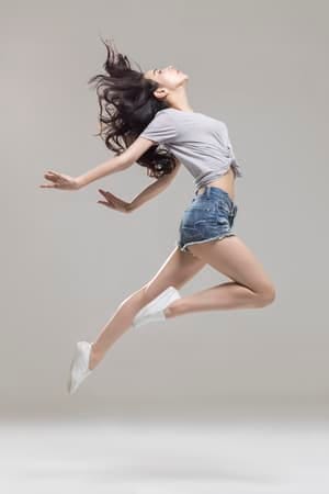 a girl is dancing and jumping