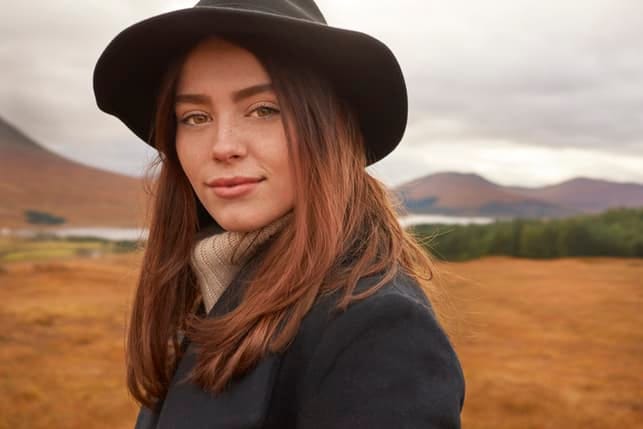 Magnificent girl in a black hat