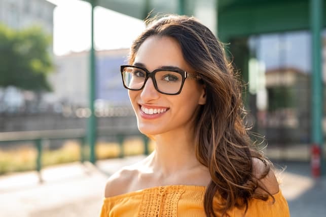 a portrait of a woman in glasses