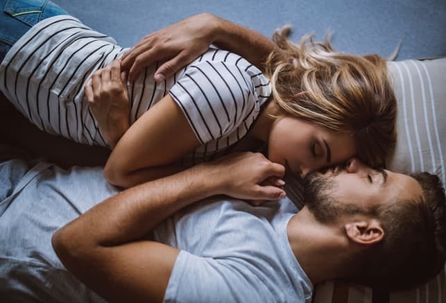 a sleepy couple hugging